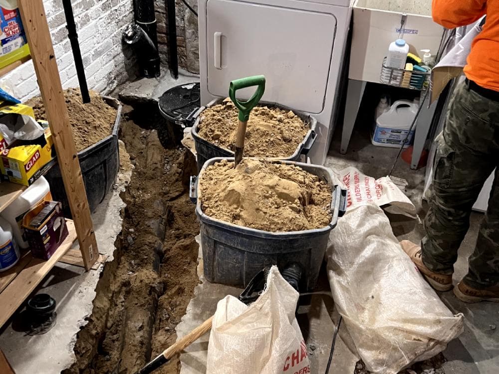 Technician repairing an underground residential drain line