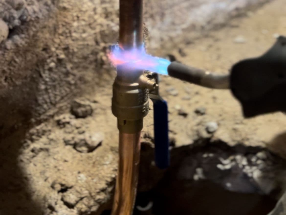 Technician replacing a private-side water service line