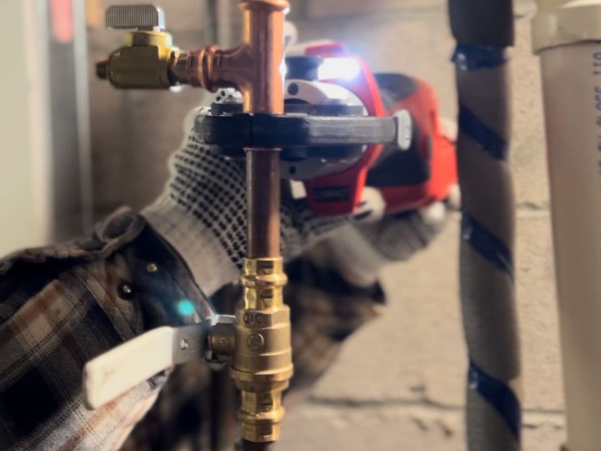 Technician replacing a private-side water service line