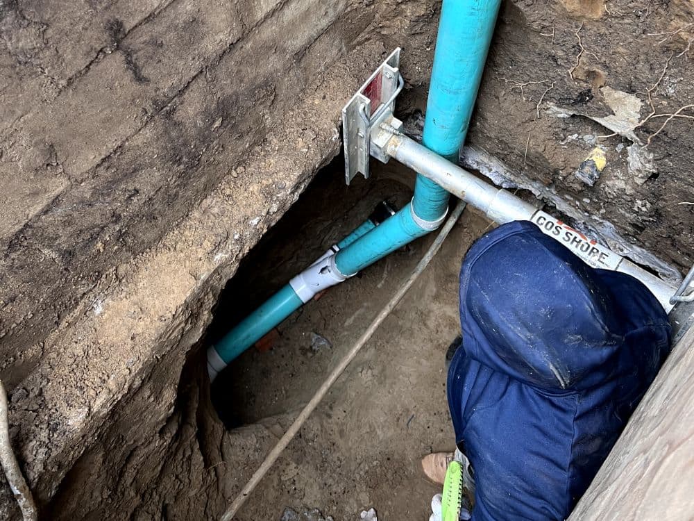 New sewer and drain line installation in a residential trench