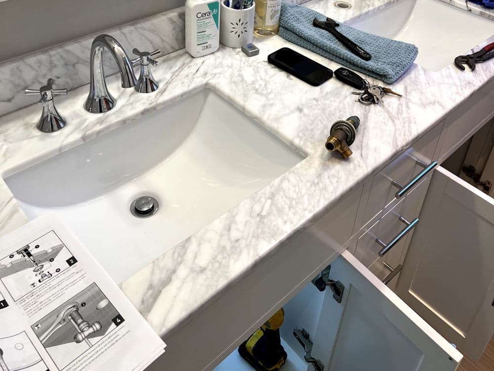 Licensed plumber completing a residential repair
